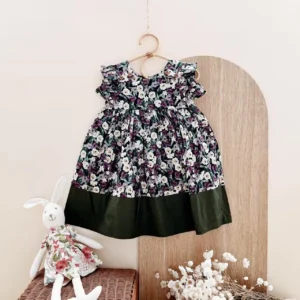 dark purple floral baby dress color block hem ruffle shoulders wooden buttons